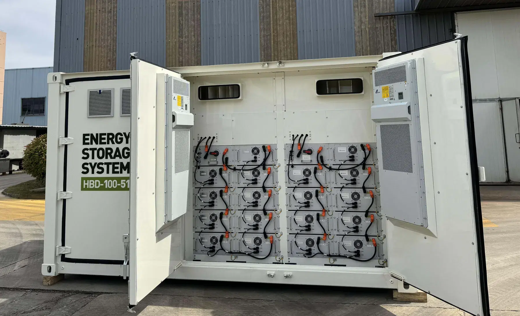 Illustration of commercial battery cabinets with controls, monitoring lines, and power-flow diagrams